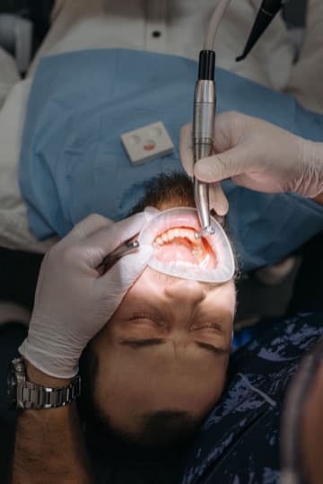 Cosmetic dental work being carried out at the chair Cosmetic dental work being carried out at the chair
